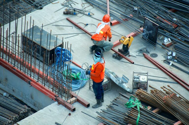 Construction workers on a site where lifting equipment inspection is required